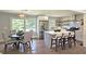 Open concept kitchen and dining area with stainless steel appliances, quartz countertops, and hardwood floors at 217 Penelope Nw Dr, Atlanta, GA 30314