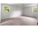 Bedroom featuring plush carpet and large windows at 4444 Bending River Sw Trl, Lilburn, GA 30047