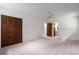 Bedroom featuring plush carpet, closet, and bathroom access at 4444 Bending River Sw Trl, Lilburn, GA 30047