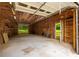 Spacious garage with exposed rafters and built-in shelving, offering ample storage at 4444 Bending River Sw Trl, Lilburn, GA 30047