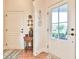 Bright foyer featuring hardwood floors and a charming accent table at 5641 Tisbury Ct, Hoschton, GA 30548