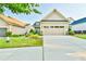 Attractive home with a two-car garage and well-maintained landscaping at 5641 Tisbury Ct, Hoschton, GA 30548
