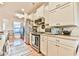 Bright kitchen features stainless steel appliances, subway tile backsplash, and light countertops at 5641 Tisbury Ct, Hoschton, GA 30548