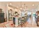 Modern kitchen with a large island and stainless steel appliances at 5641 Tisbury Ct, Hoschton, GA 30548