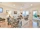 Inviting living room with hardwood floors, comfortable seating, and ample natural light at 5641 Tisbury Ct, Hoschton, GA 30548
