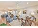 Open-concept living room featuring hardwood floors and seamless connection to the kitchen at 5641 Tisbury Ct, Hoschton, GA 30548