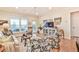Bright living room featuring hardwood floors, a comfortable seating area and TV at 5641 Tisbury Ct, Hoschton, GA 30548
