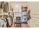 Spacious walk-in closet features custom shelves, storage, and wood floors at 5641 Tisbury Ct, Hoschton, GA 30548