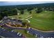 Panoramic aerial view of a golf course with lush green fairways, pristine greens, and surrounding residential area at 710 Glen Royal Dr, Roswell, GA 30076