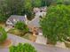 Residential street aerial shot showcasing the tree lined homes in a suburban cul-de-sac at 710 Glen Royal Dr, Roswell, GA 30076