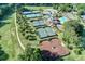Overhead view of tennis courts and a pool; the lush landscape enhances the appeal of this recreational area at 710 Glen Royal Dr, Roswell, GA 30076