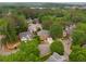 Aerial view of a residential community with mature trees and well-manicured lawns at 710 Glen Royal Dr, Roswell, GA 30076