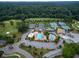 Aerial view of community amenities including tennis courts, a pool, clubhouse, and golf course, for recreation at 710 Glen Royal Dr, Roswell, GA 30076
