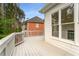 Wide back deck with wood flooring and overlooking yard at 710 Glen Royal Dr, Roswell, GA 30076