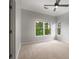 Bedroom with carpet, ceiling fan, and windows at 710 Glen Royal Dr, Roswell, GA 30076