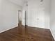 Bedroom featuring hardwood floors, an airy feel, and double door closets at 710 Glen Royal Dr, Roswell, GA 30076