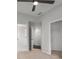 Neutral bedroom featuring carpet, ceiling fan, and closet with easy access to the hallway at 710 Glen Royal Dr, Roswell, GA 30076