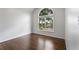 Bedroom featuring hardwood floors and a big window at 710 Glen Royal Dr, Roswell, GA 30076