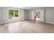 A spacious bonus room with large windows offering natural light and backyard views at 710 Glen Royal Dr, Roswell, GA 30076