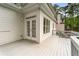Exterior view of a white deck with railing and access to the house at 710 Glen Royal Dr, Roswell, GA 30076