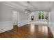 Open floor plan with hardwood floors, wainscoting, and archway to the living room at 710 Glen Royal Dr, Roswell, GA 30076