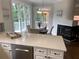 Bright eat-in kitchen features white cabinets, stainless steel appliances, and modern finishes at 710 Glen Royal Dr, Roswell, GA 30076