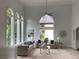 Spacious living room with large windows, neutral tones, and cozy seating at 710 Glen Royal Dr, Roswell, GA 30076