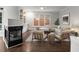 Cozy living room with fireplace, built-in shelves, and ample natural light at 710 Glen Royal Dr, Roswell, GA 30076