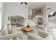 Open-concept living area with stylish furniture, staircase view, and archway to the dining room at 710 Glen Royal Dr, Roswell, GA 30076