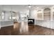 Open concept living area featuring fireplace, hardwood floors, and ample natural light at 710 Glen Royal Dr, Roswell, GA 30076