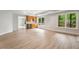 An open-concept living area with large windows, leading to a stylish wet bar at 710 Glen Royal Dr, Roswell, GA 30076