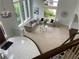 Aerial view of the living room featuring large windows, neutral tones, and cozy seating at 710 Glen Royal Dr, Roswell, GA 30076