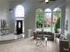 Bright living room features large windows, sofas, and elegant decor at 710 Glen Royal Dr, Roswell, GA 30076