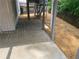Spacious covered patio area featuring wood columns and direct access to the backyard and upper deck stairs at 710 Glen Royal Dr, Roswell, GA 30076