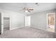 Spacious main bedroom with neutral walls and carpet, walk-in closet, and ensuite bathroom with shower at 7629 Park Ln, Jonesboro, GA 30236