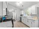 Bright kitchen with granite countertops, stainless steel appliances, white cabinets, and eat-in bar area at 7629 Park Ln, Jonesboro, GA 30236