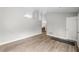Open-concept living space with wood-look floors and neutral walls creating a seamless flow at 7629 Park Ln, Jonesboro, GA 30236