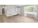 Bright living room featuring wood-look floors, neutral walls, and bay window at 7629 Park Ln, Jonesboro, GA 30236