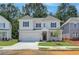 Charming two-story home featuring a white brick facade, well-manicured lawn, and inviting curb appeal at 3672 Silvery Way, Powder Springs, GA 30127