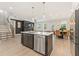 Open-concept kitchen with a central island, stainless steel appliances, and adjoining dining area at 3672 Silvery Way, Powder Springs, GA 30127