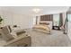 Spacious main bedroom features a sitting area, neutral decor, and modern furniture at 3672 Silvery Way, Powder Springs, GA 30127
