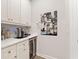 Well-organized pantry with custom cabinets, countertops, and a beverage refrigerator at 3672 Silvery Way, Powder Springs, GA 30127