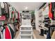 Large, organized walk-in closet features shelving, racks, and drawers for ample storage at 3672 Silvery Way, Powder Springs, GA 30127