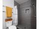 Modern bathroom with gray tiled shower and a sleek shower head, alongside a toilet and towel rack at 381 Ralph Mcgill Ne Blvd # K, Atlanta, GA 30312