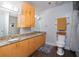 Bright bathroom featuring double sinks with granite countertops, honey-colored cabinets, and a large mirror at 381 Ralph Mcgill Ne Blvd # K, Atlanta, GA 30312