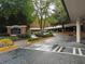 City Heights Condominiums entrance featuring mature trees and covered parking at 381 Ralph Mcgill Ne Blvd # K, Atlanta, GA 30312