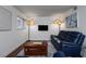 Comfortable living room featuring contemporary decor, hardwood floors, a sleek TV, and a comfortable blue leather couch at 381 Ralph Mcgill Ne Blvd # K, Atlanta, GA 30312