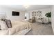 Spacious main bedroom featuring a lounge chair, work desk, and neutral paint colors at , Powder Springs, GA 30127