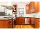 Kitchen showcasing stainless steel oven, dishwasher, granite countertops, and light wood cabinetry at 1125 Briarcliff Ne Pl # 14, Atlanta, GA 30306