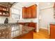 Beautiful kitchen showcasing a cooktop island, granite countertops, stainless steel appliances, and hardwood floors at 1125 Briarcliff Ne Pl # 14, Atlanta, GA 30306